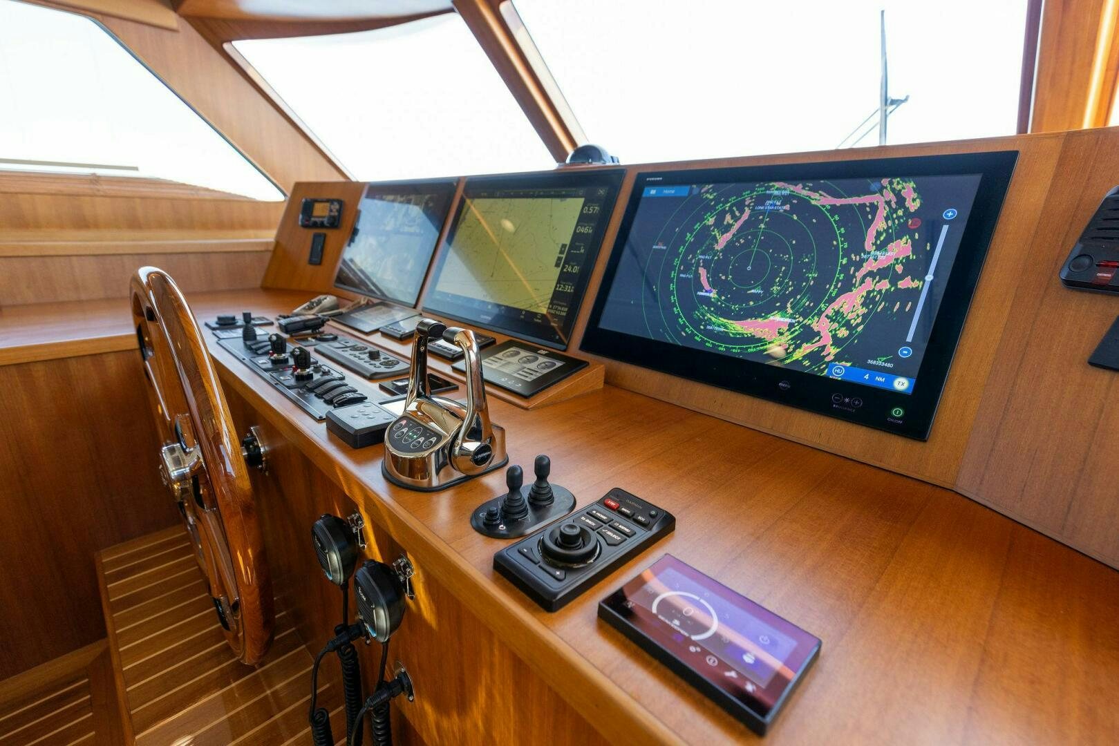 a desk with a computer and a television on it aboard SUNZSET Yacht for Sale