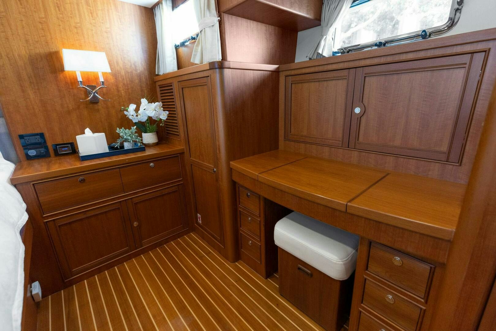 a kitchen with wooden cabinets aboard SUNZSET Yacht for Sale