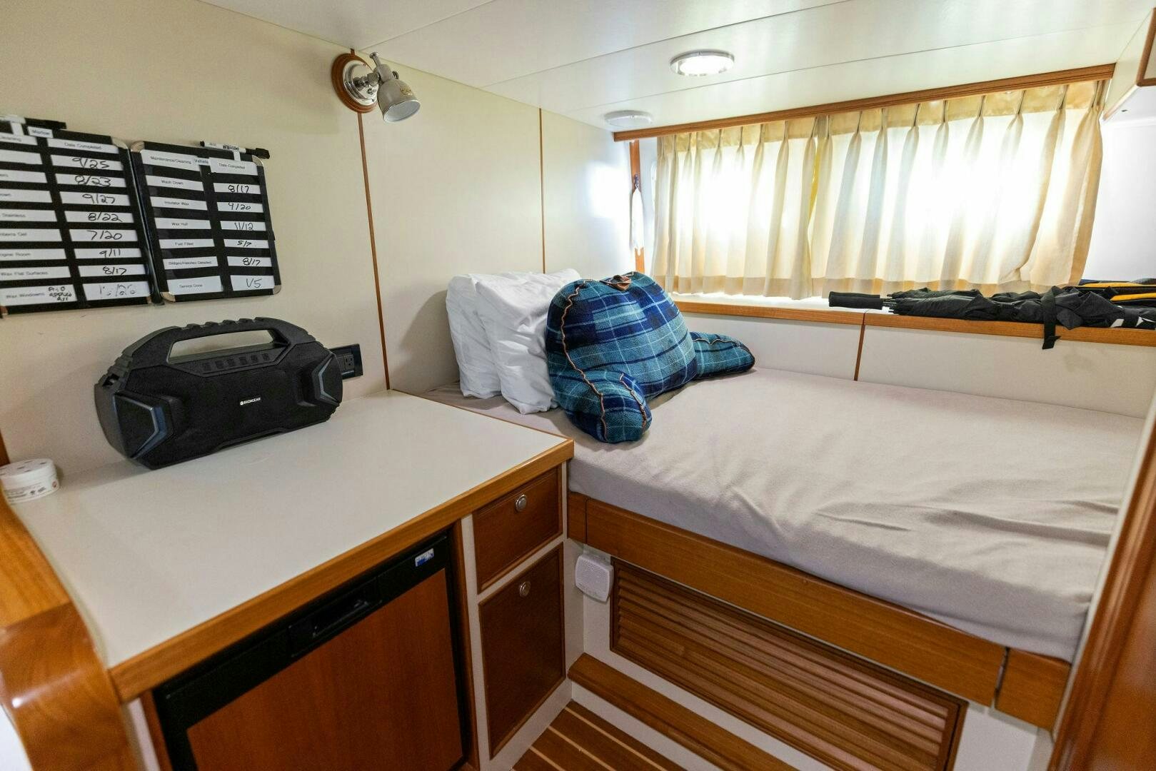 a bedroom with a bed and a desk aboard SUNZSET Yacht for Sale