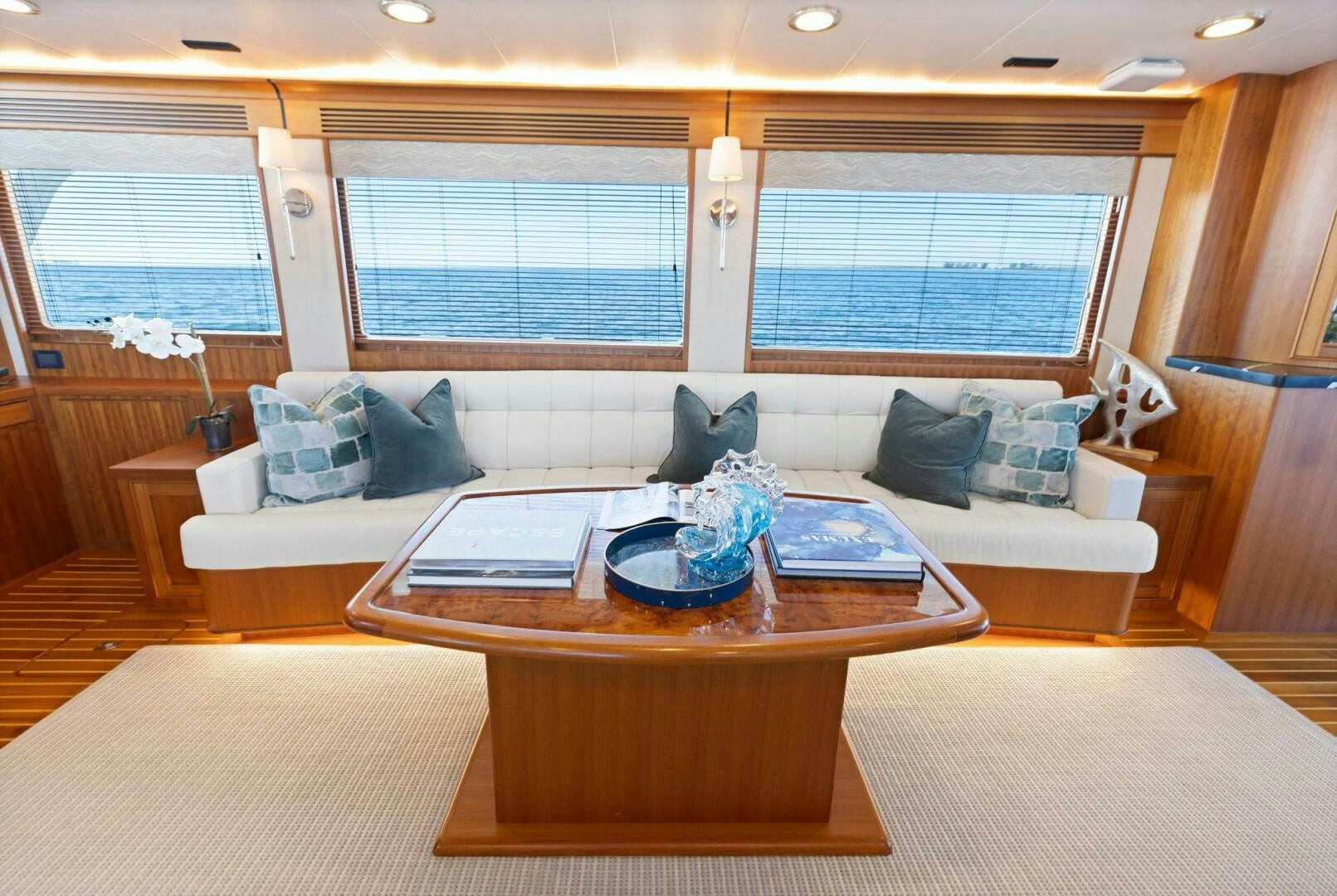 a living room with a couch and a table aboard SUNZSET Yacht for Sale