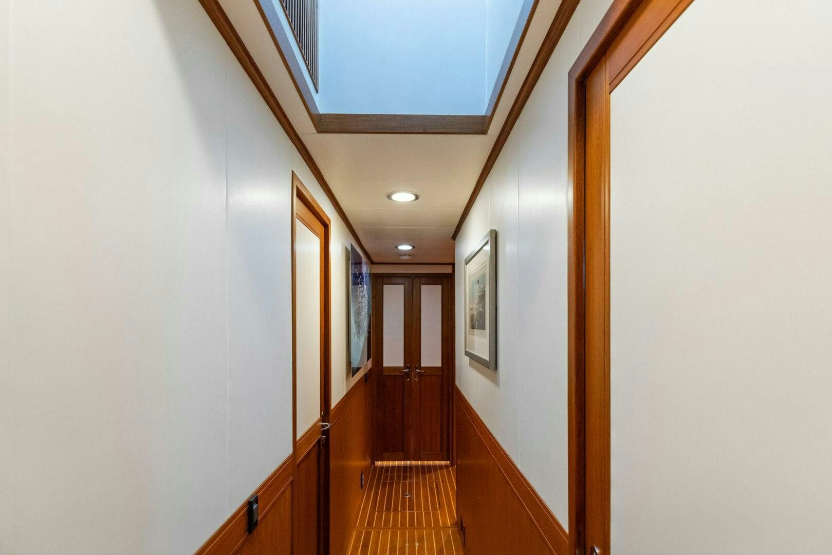 a hallway with wood floors aboard SUNZSET Yacht for Sale