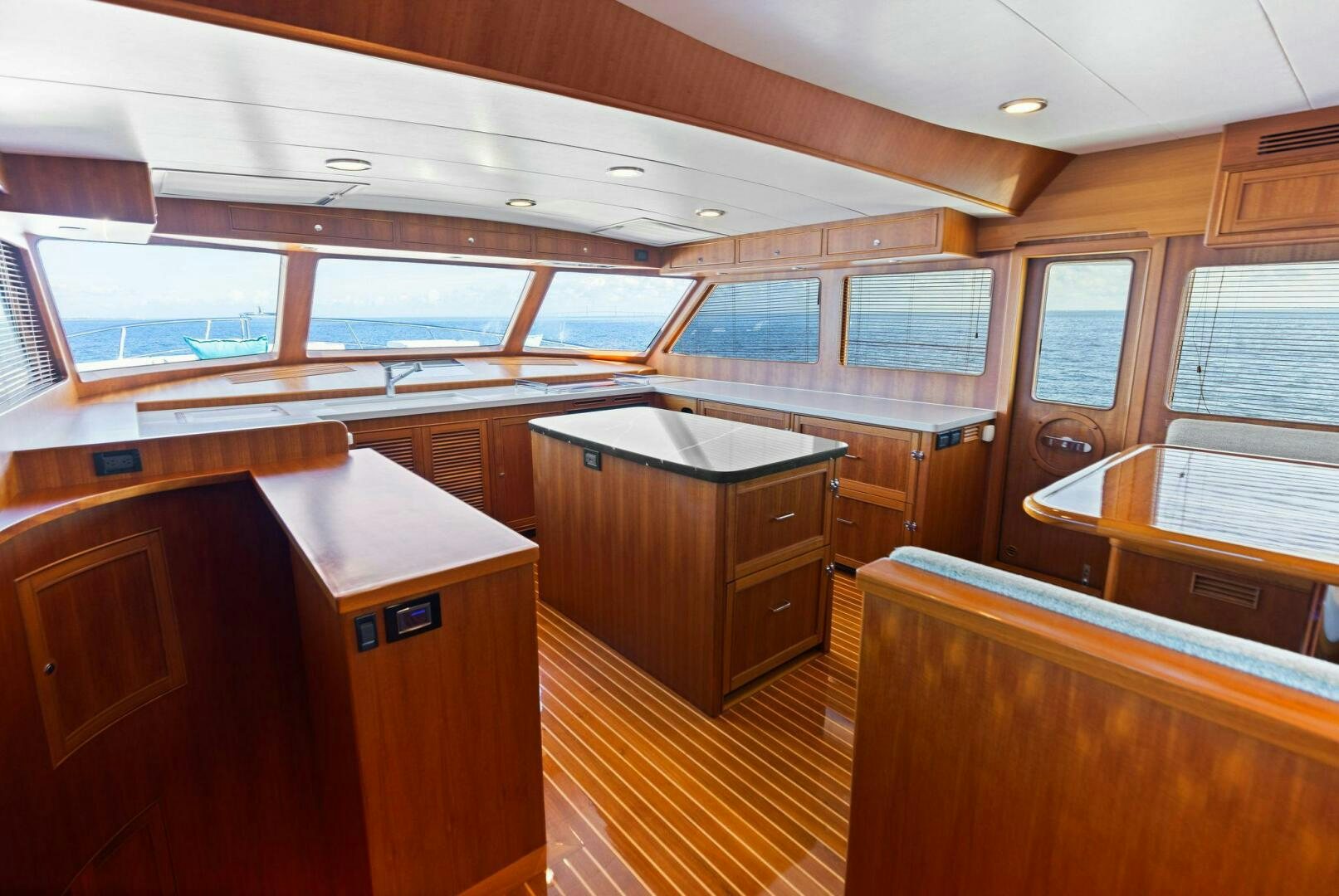 a room with wooden cabinets and a window aboard SUNZSET Yacht for Sale