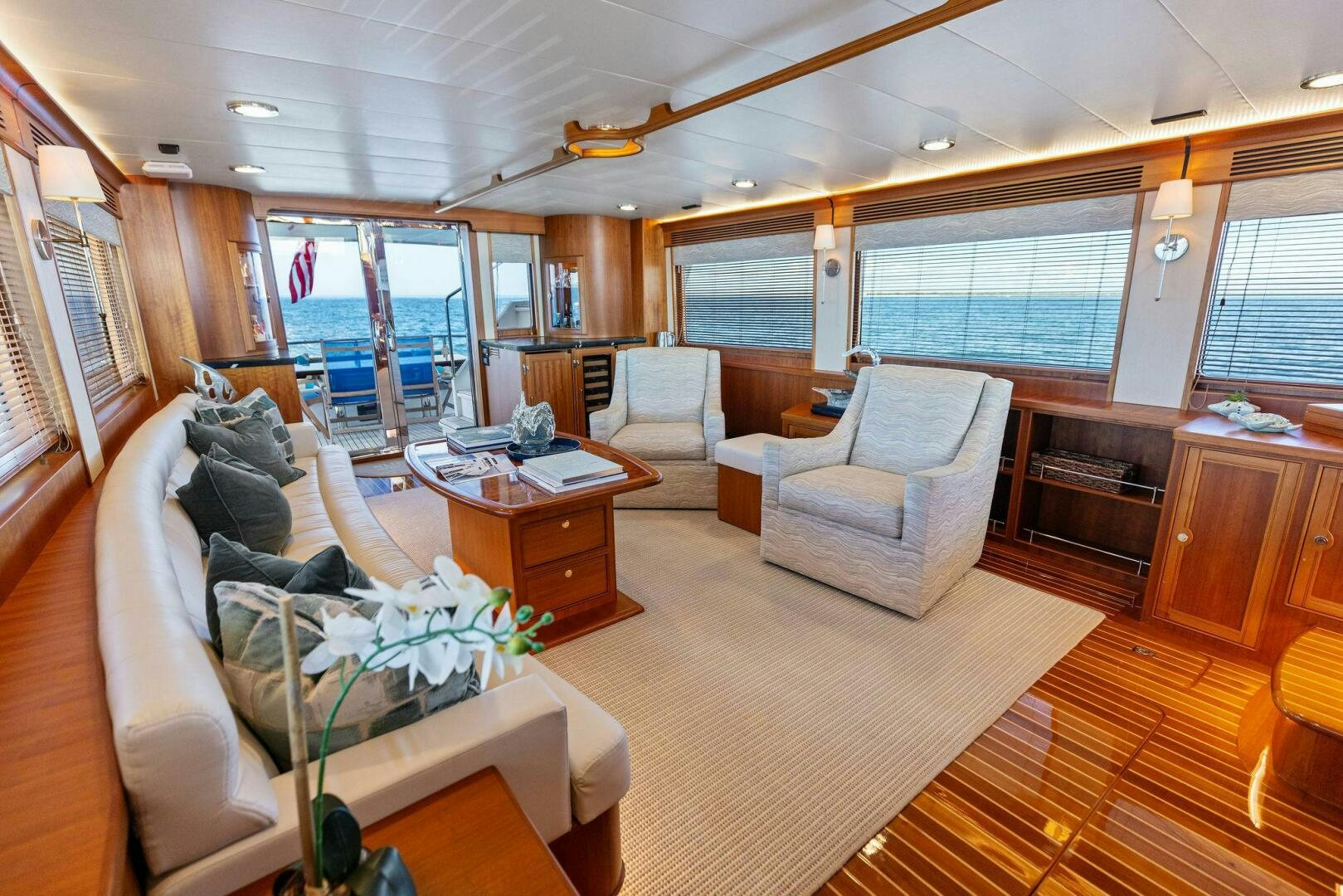 a living room with a couch and a table aboard SUNZSET Yacht for Sale
