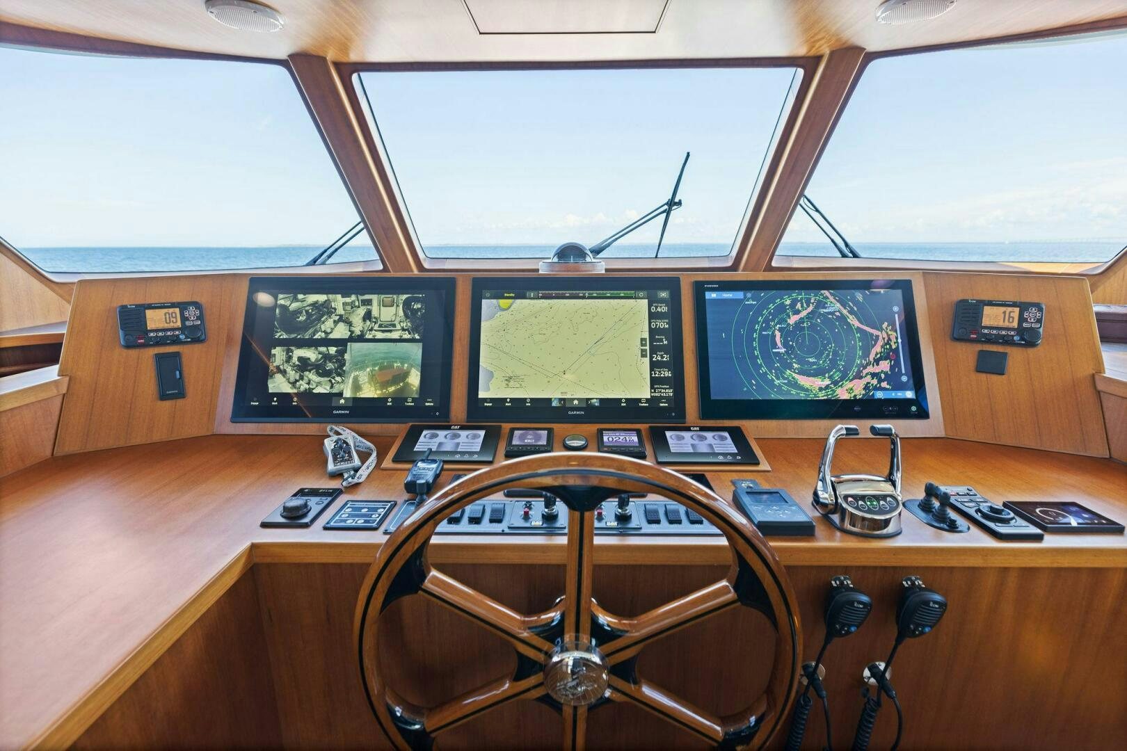 a control room with several monitors aboard SUNZSET Yacht for Sale
