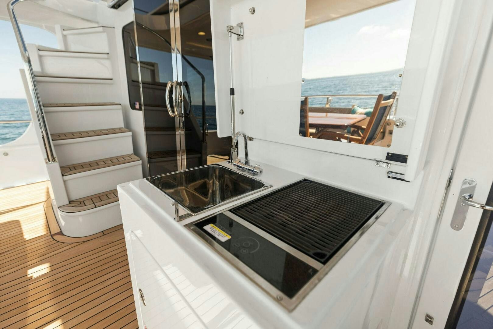 a kitchen with a sink and a stove aboard SUNZSET Yacht for Sale