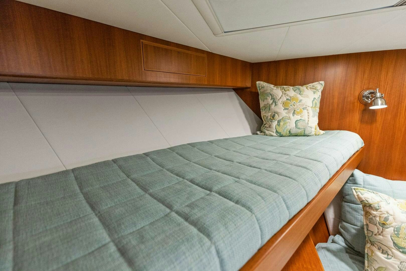 a bed with a pillow aboard SUNZSET Yacht for Sale