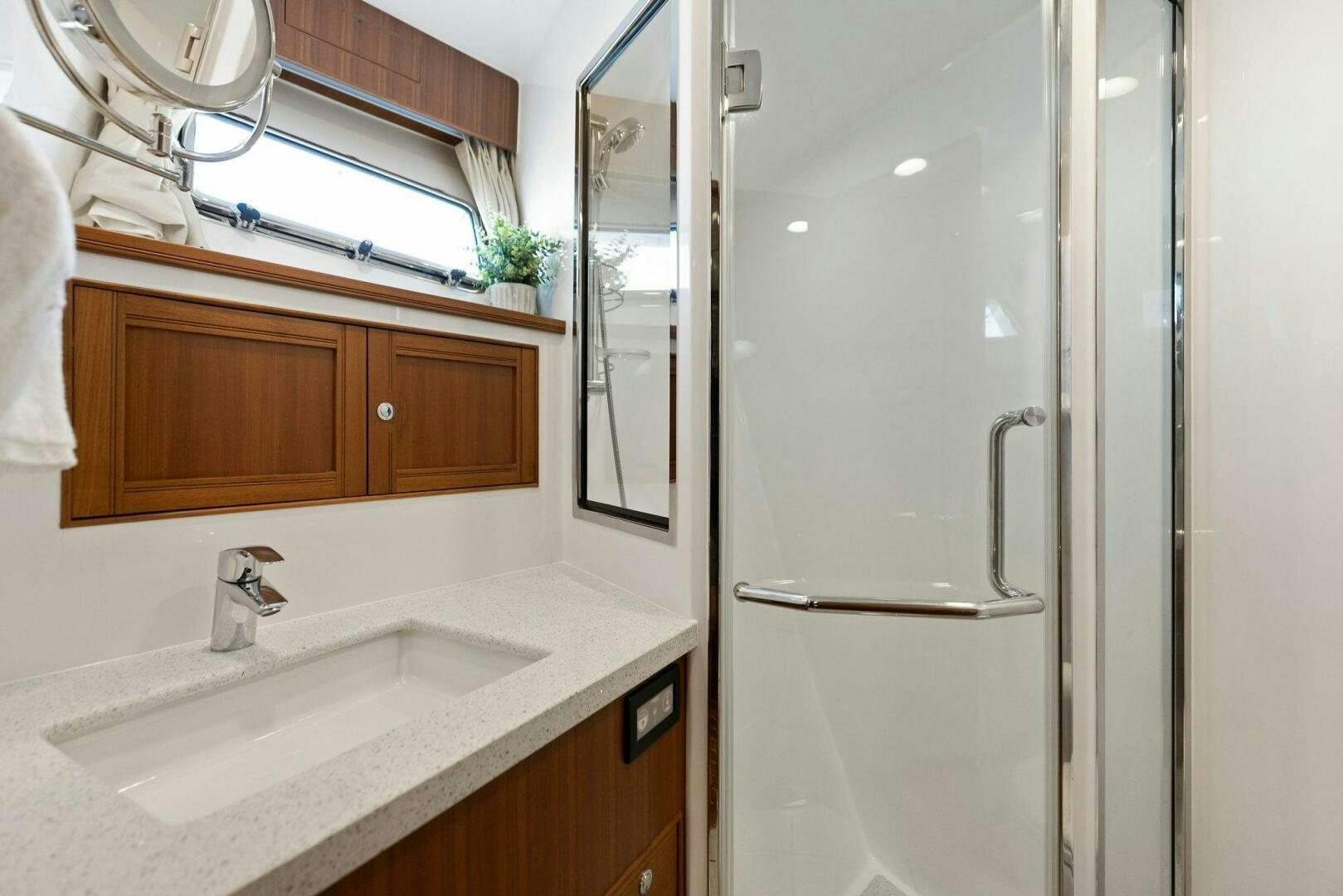 a bathroom with a sink and a shower aboard SUNZSET Yacht for Sale