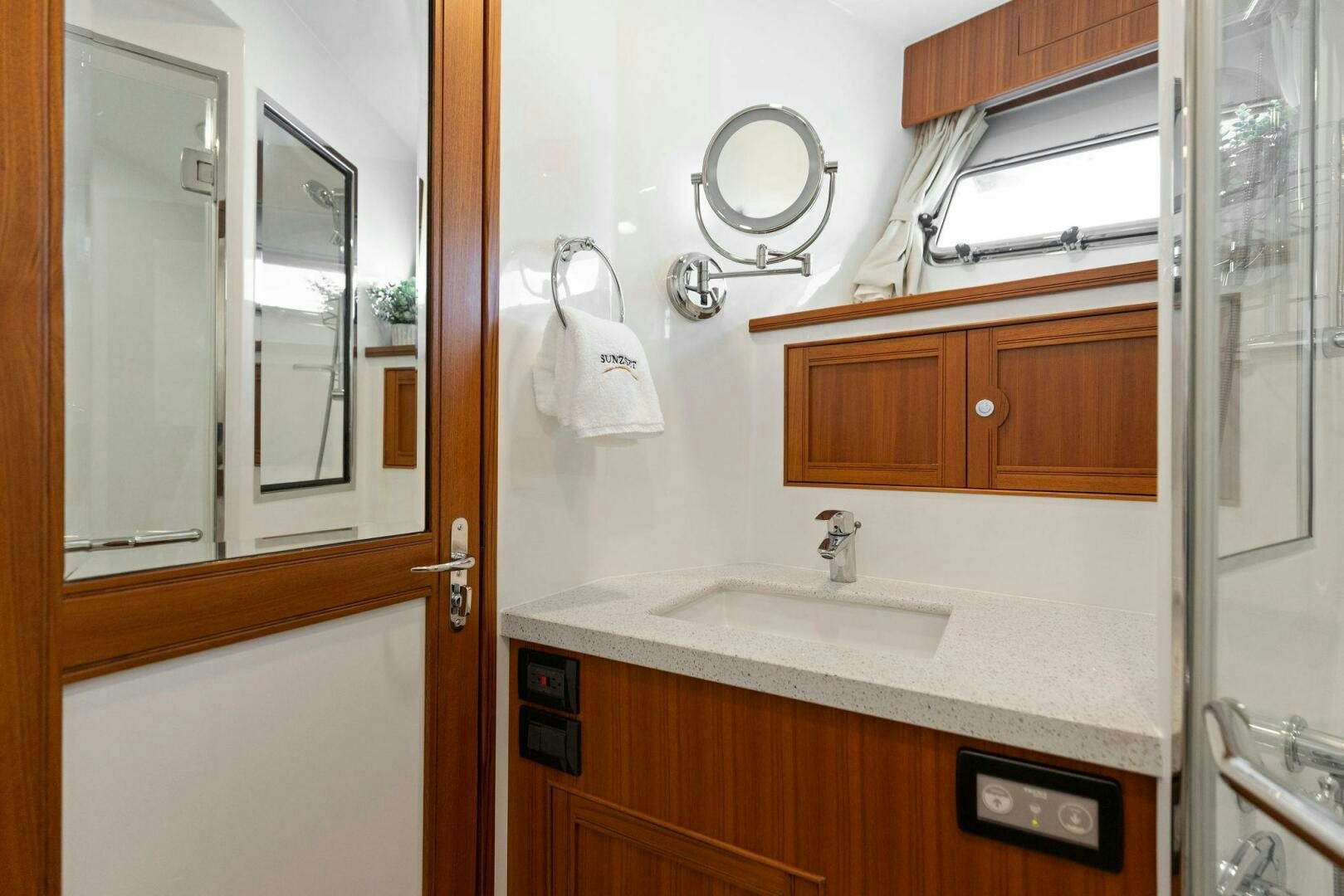 a bathroom with a sink and cabinets aboard SUNZSET Yacht for Sale