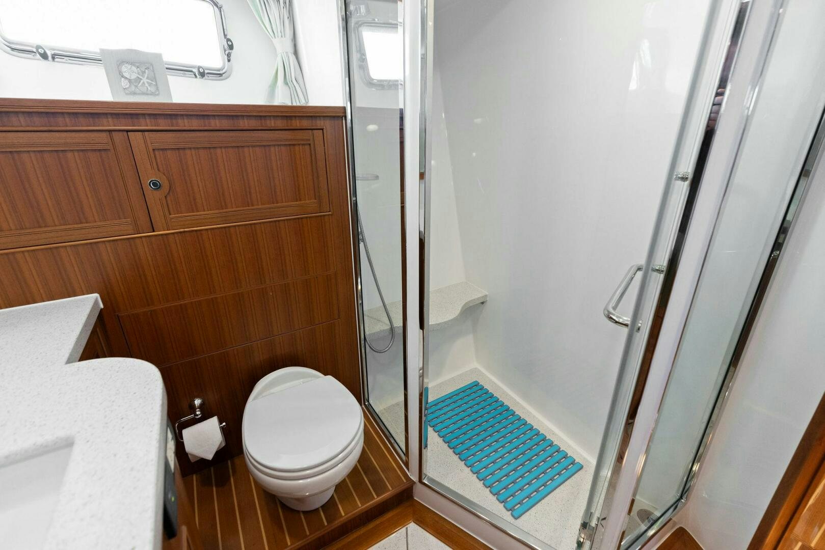 a bathroom with a glass shower aboard SUNZSET Yacht for Sale