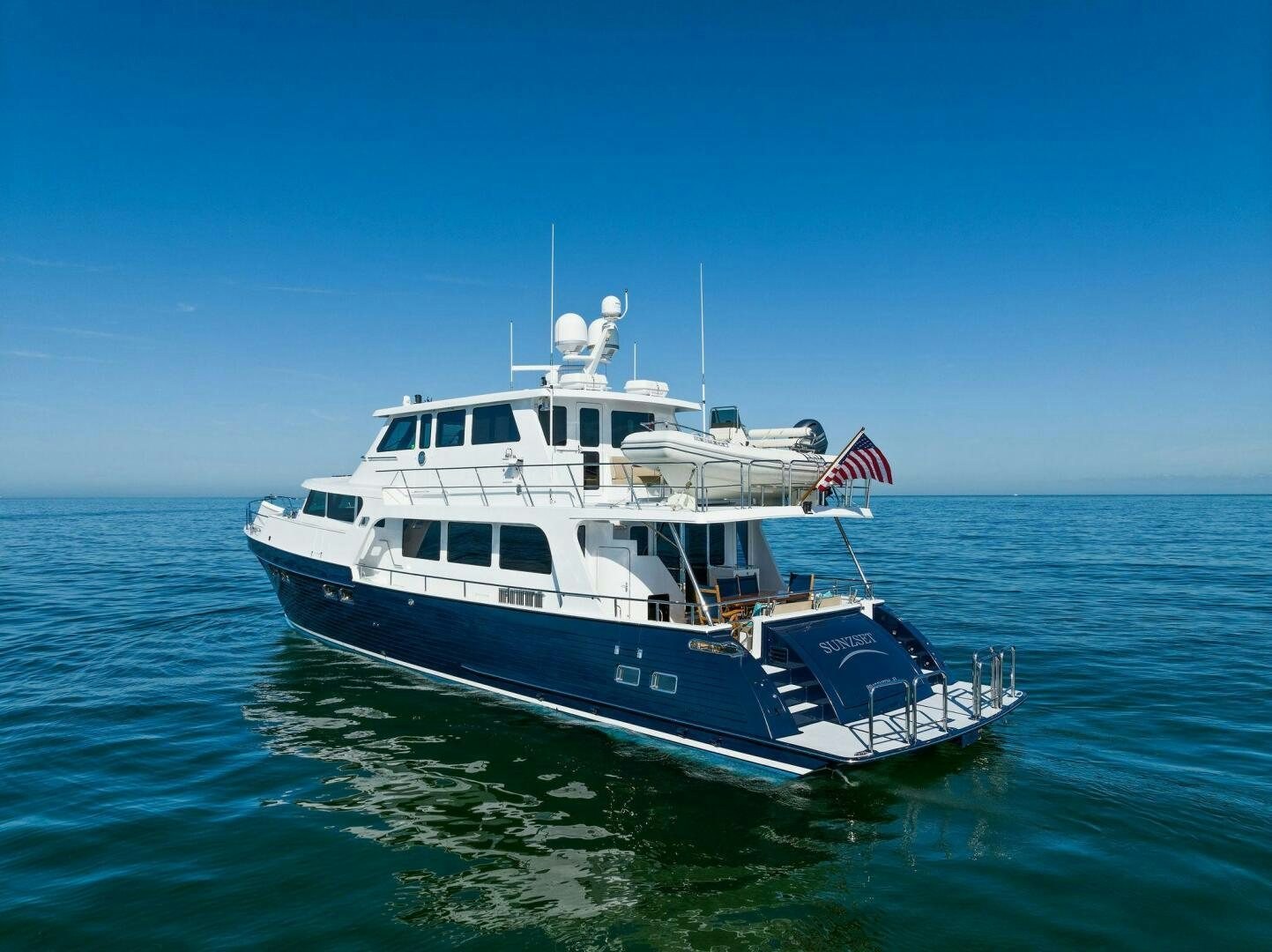 a large boat in the water aboard SUNZSET Yacht for Sale