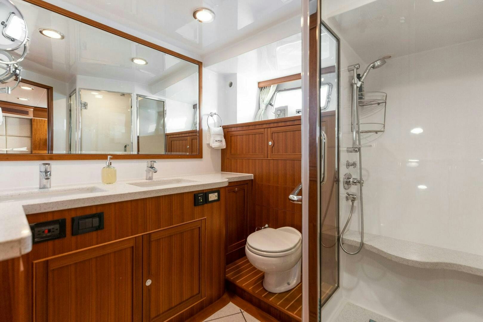 a bathroom with a glass shower aboard SUNZSET Yacht for Sale