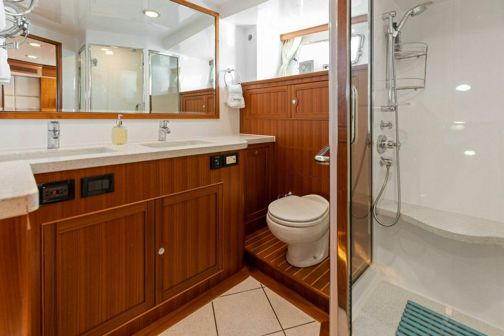 a bathroom with a glass shower aboard SUNZSET Yacht for Sale