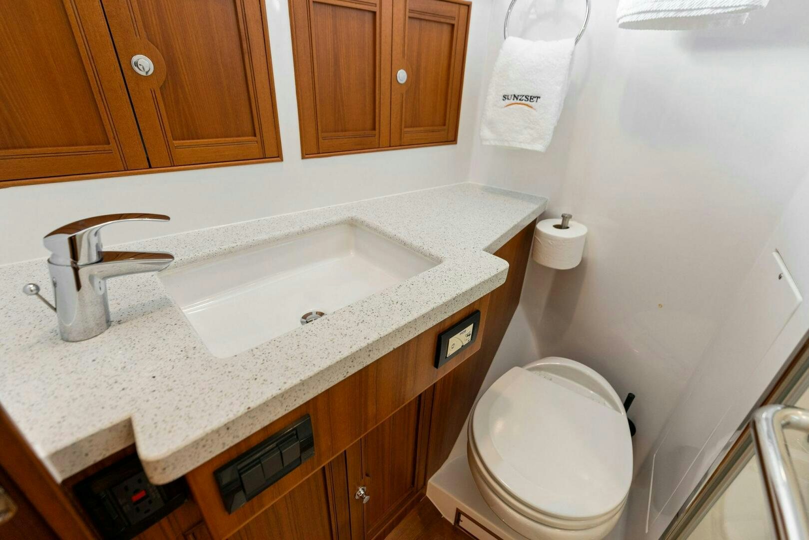 a bathroom with a toilet and sink aboard SUNZSET Yacht for Sale