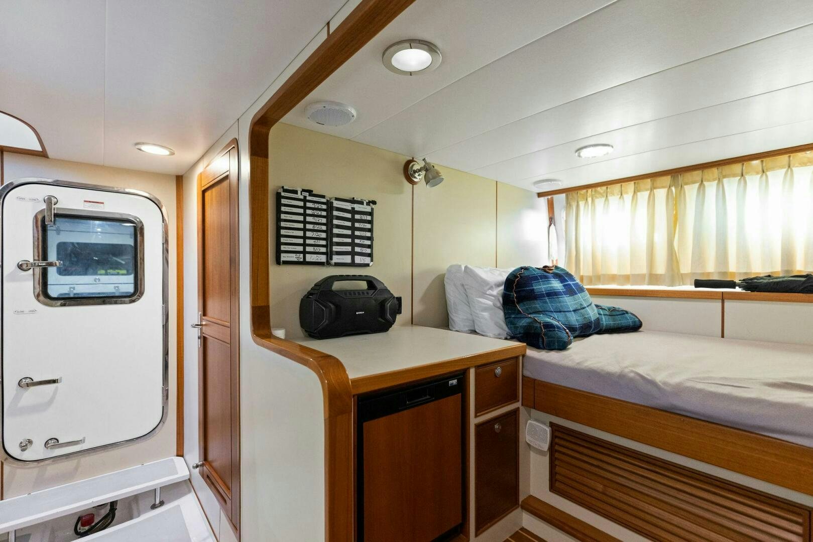 a room with a bed and a desk aboard SUNZSET Yacht for Sale