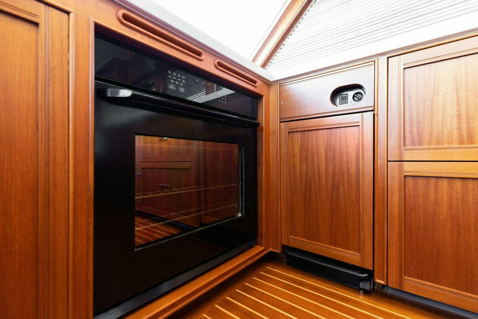 a microwave oven in a kitchen aboard SUNZSET Yacht for Sale