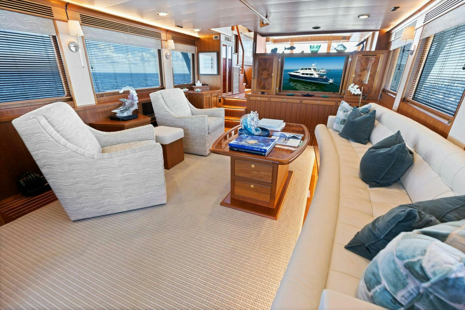 a living room with a large window aboard SUNZSET Yacht for Sale
