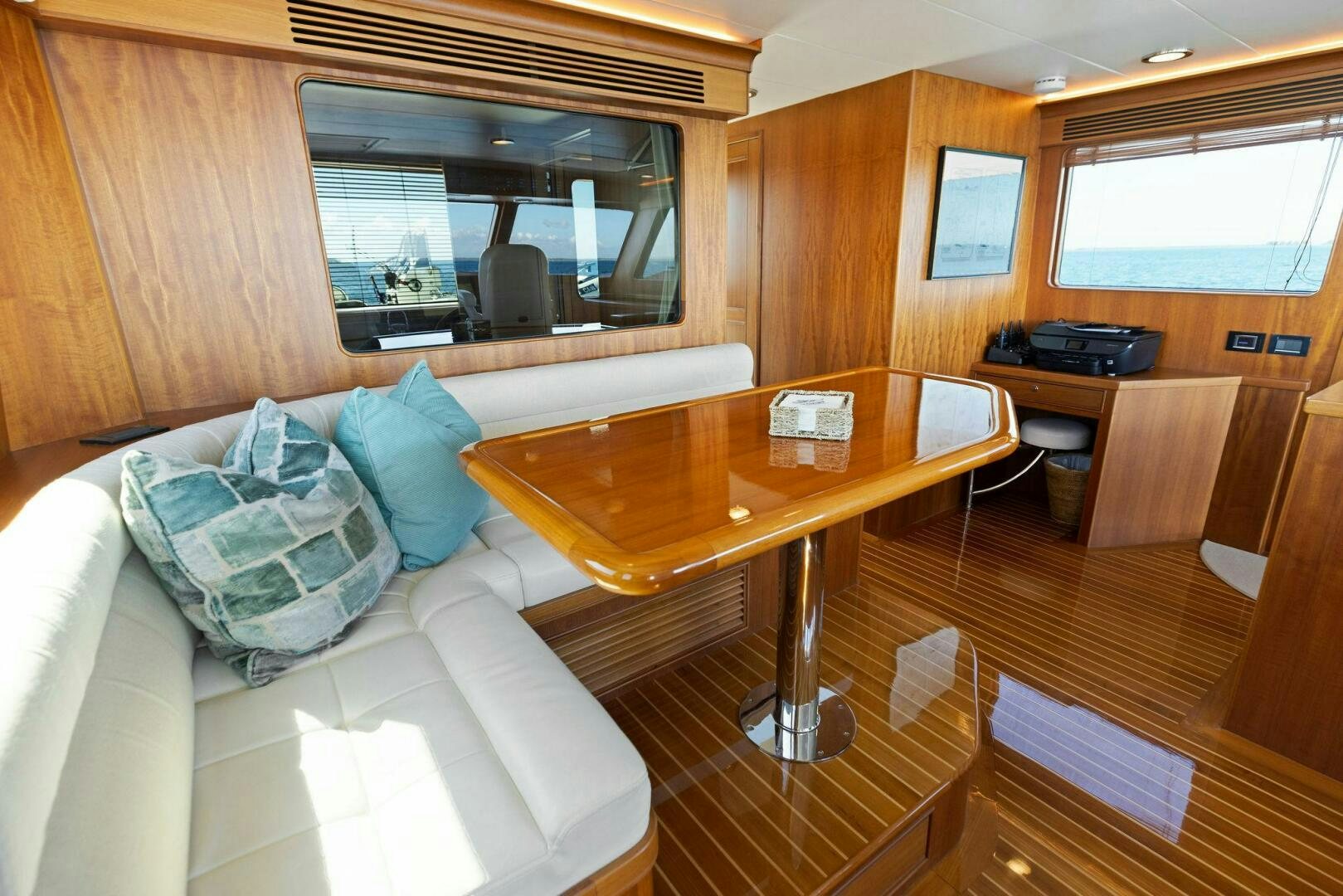 a room with a couch and a table aboard SUNZSET Yacht for Sale