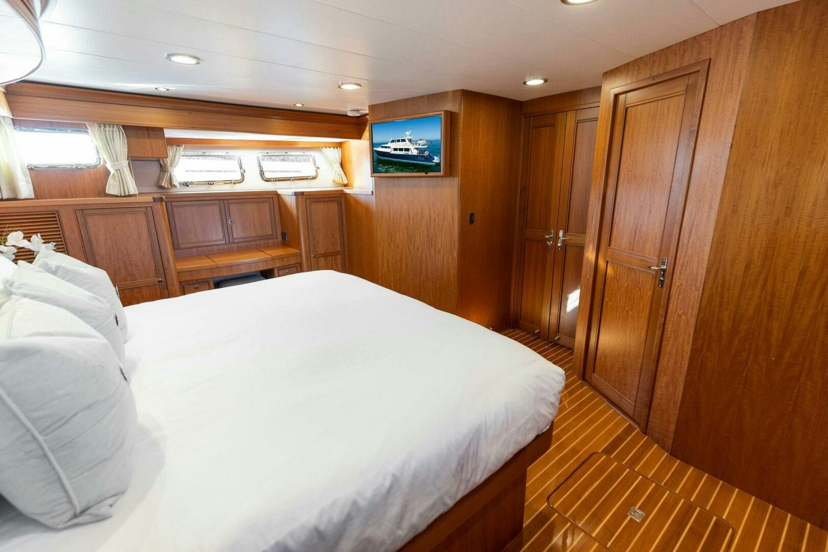 a bed in a room aboard SUNZSET Yacht for Sale