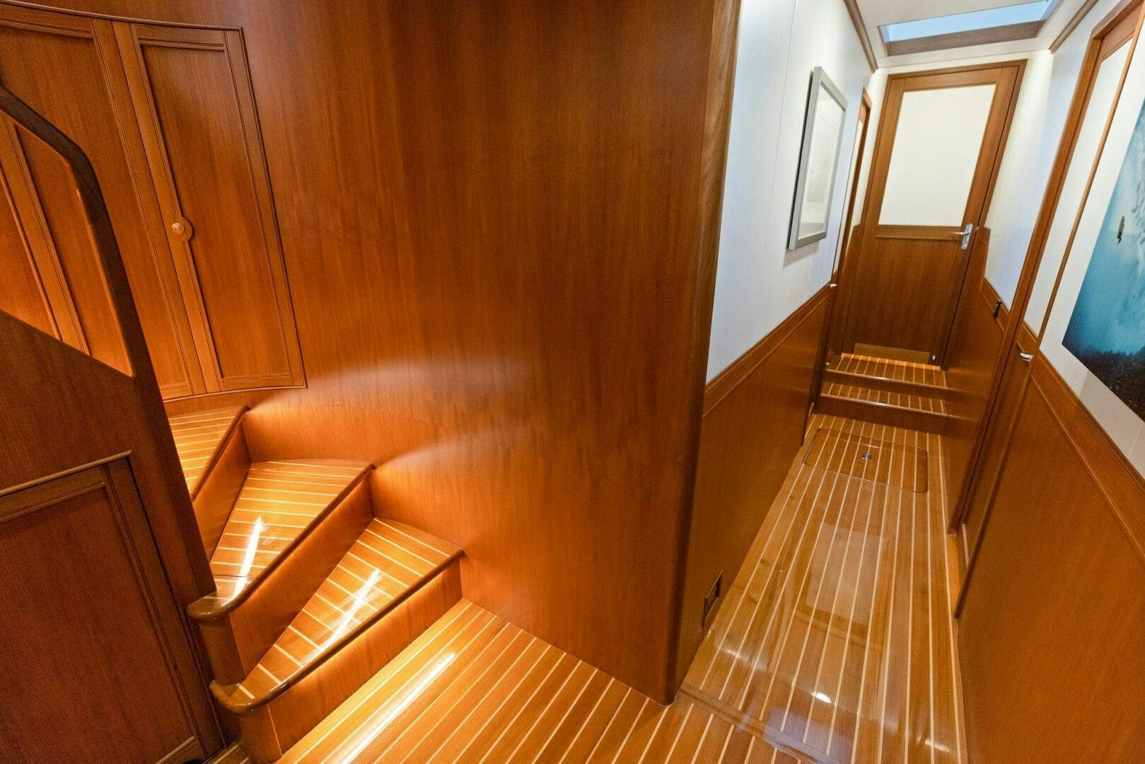 a hallway with wooden floors aboard SUNZSET Yacht for Sale