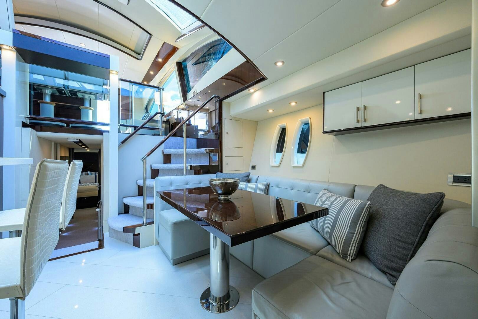 a living room with a table and couches aboard VIXEN Yacht for Sale