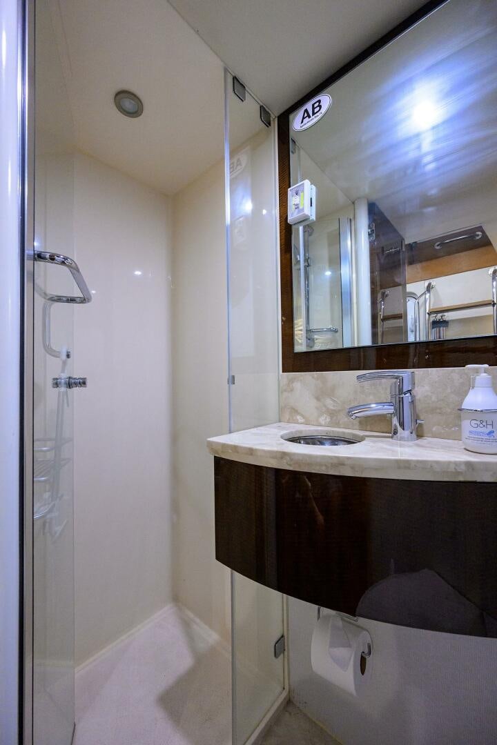 a bathroom with a sink and a mirror aboard VIXEN Yacht for Sale