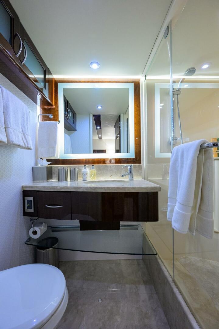 a bathroom with a sink and a mirror aboard VIXEN Yacht for Sale