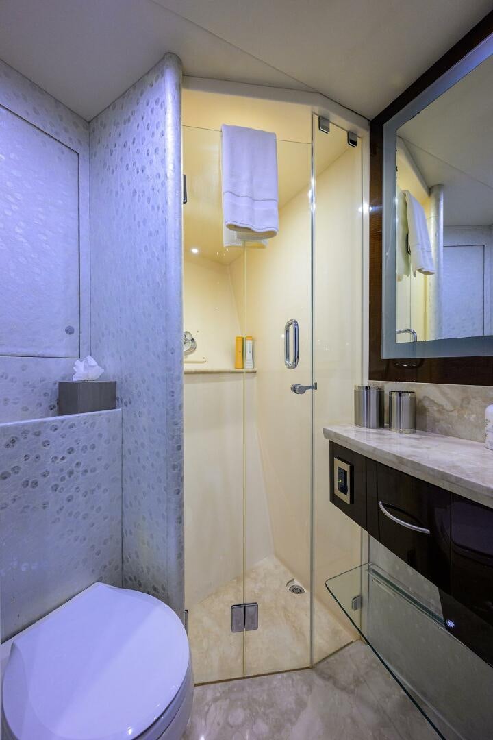 a bathroom with a toilet and a sink aboard VIXEN Yacht for Sale