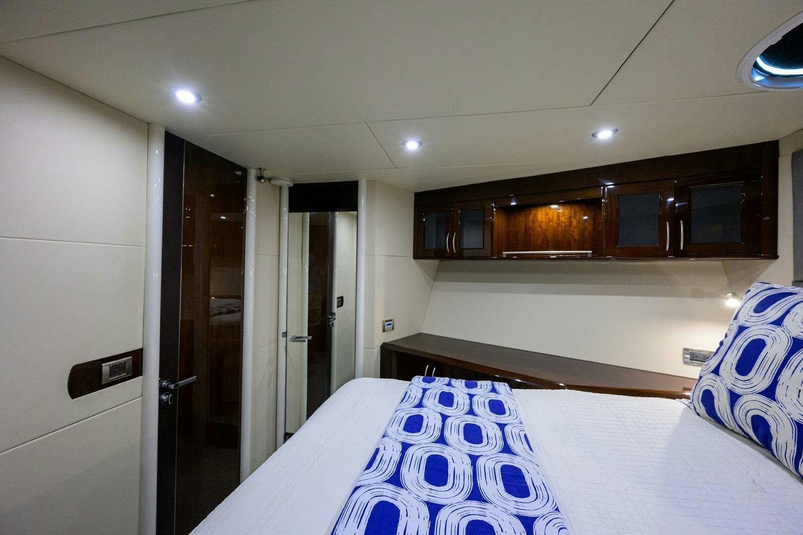 a room with a bed and a door aboard VIXEN Yacht for Sale