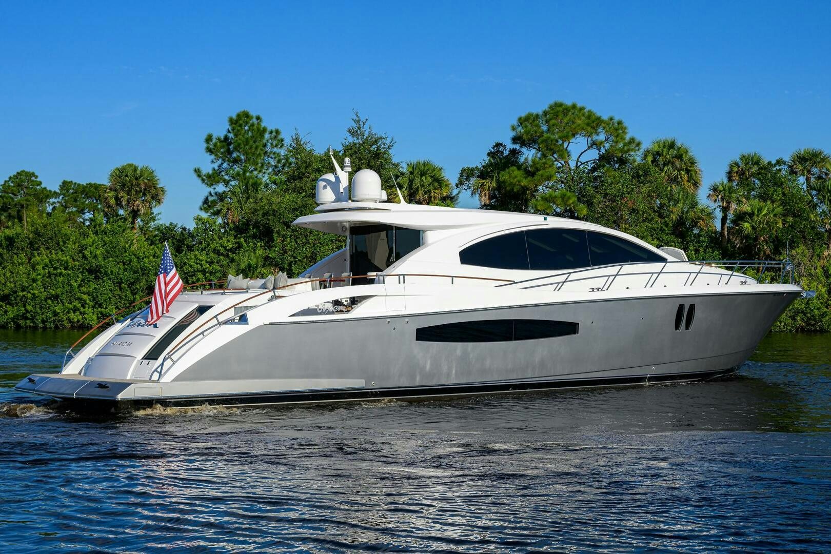 a white yacht on the water aboard VIXEN Yacht for Sale