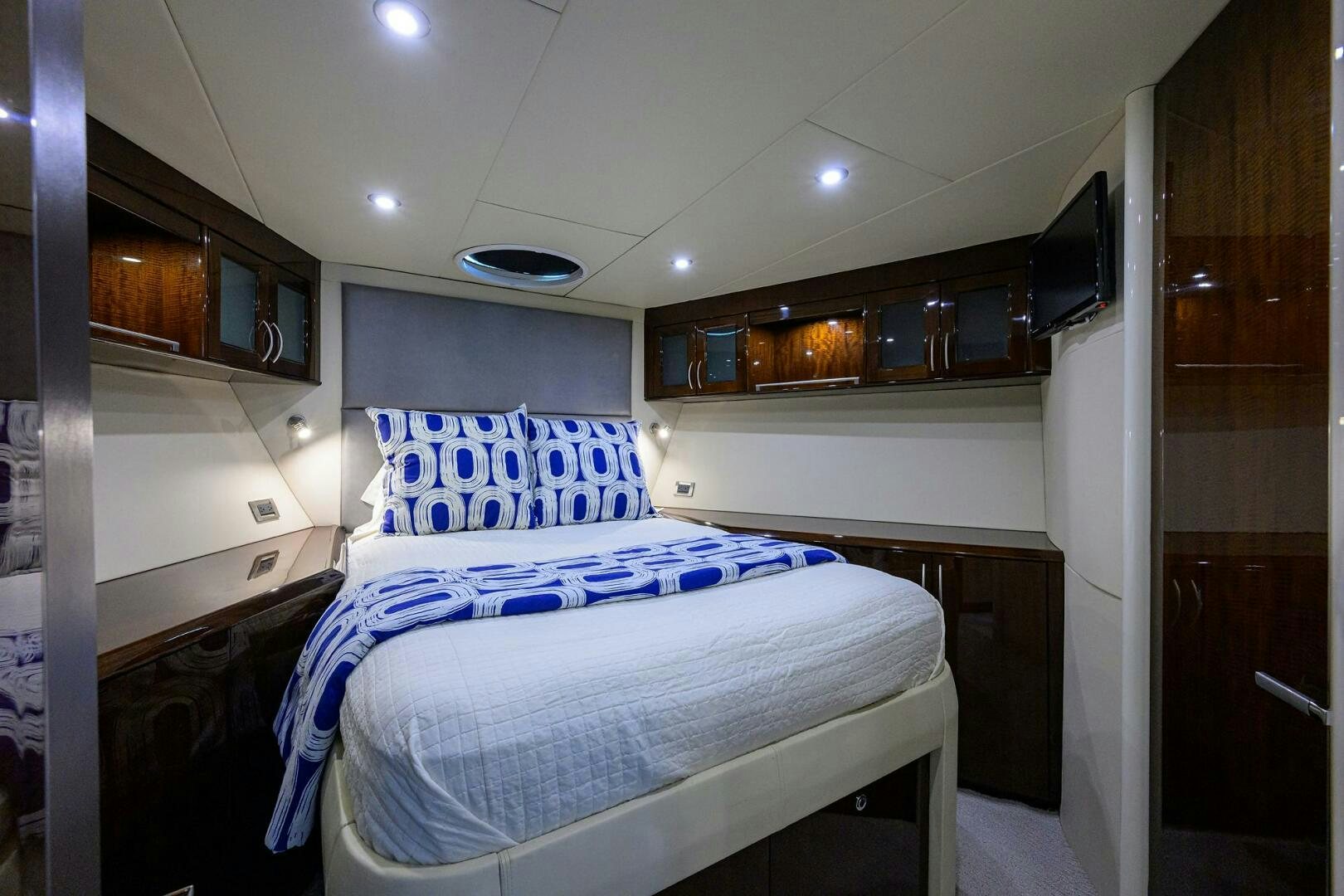 a bedroom with a bed aboard VIXEN Yacht for Sale