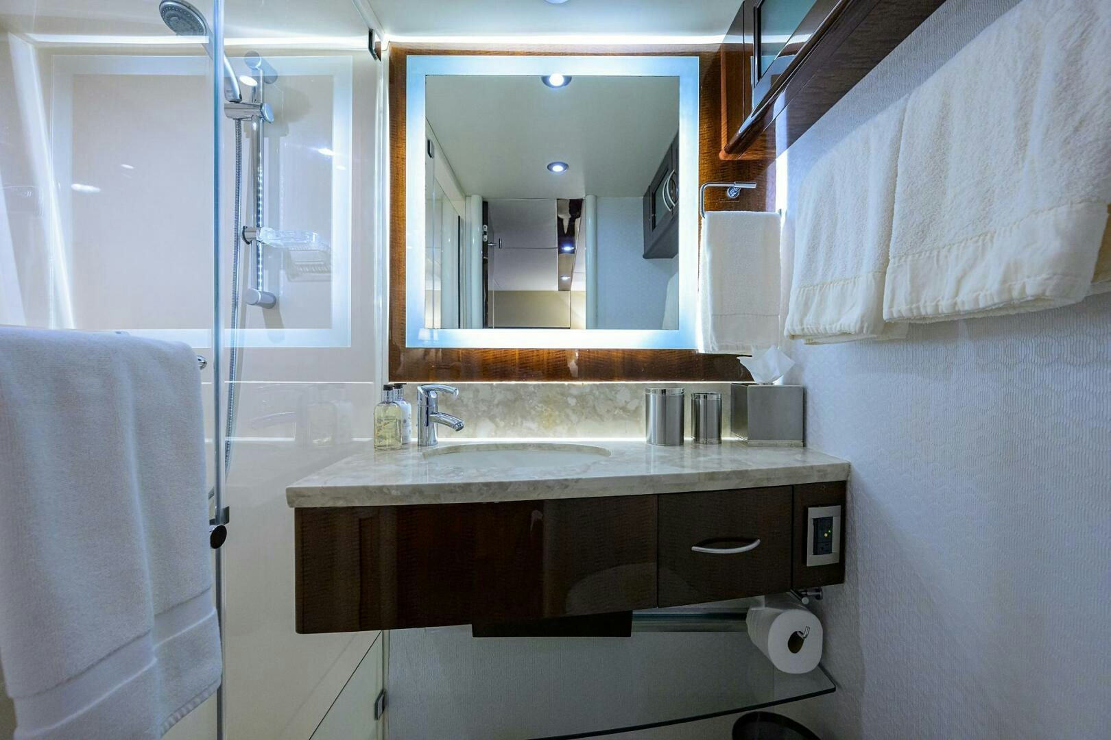a bathroom with a mirror and sink aboard VIXEN Yacht for Sale
