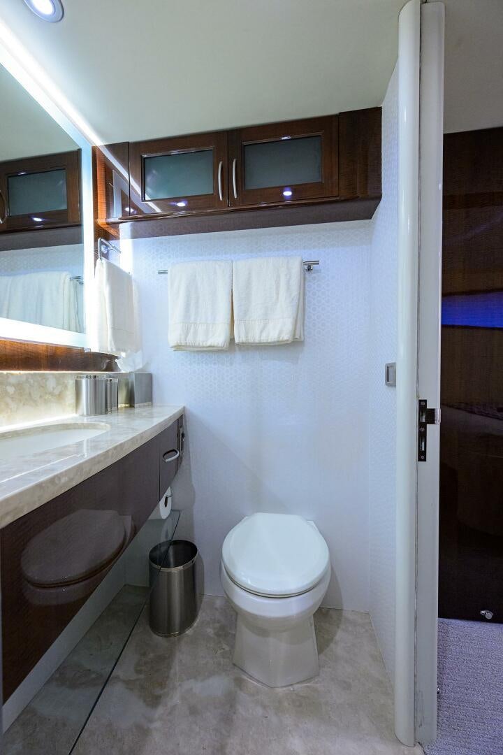 a bathroom with a toilet and sink aboard VIXEN Yacht for Sale