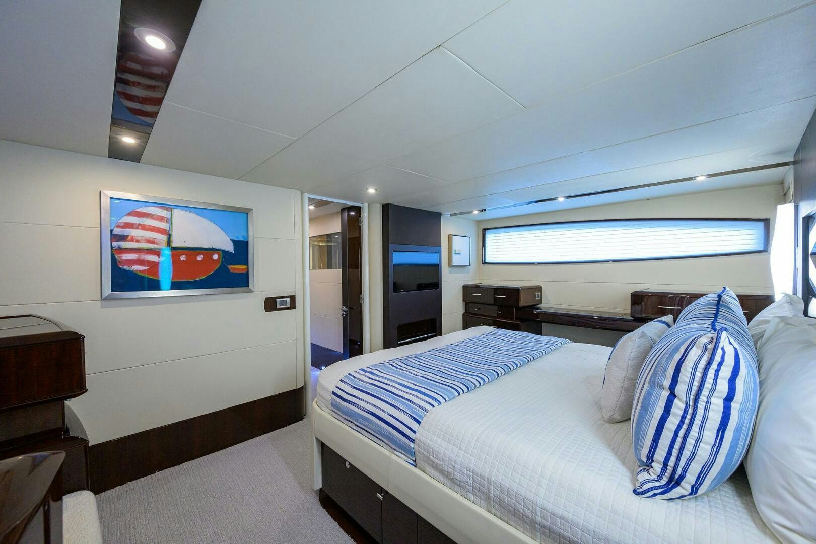 a room with a bed and a television aboard VIXEN Yacht for Sale