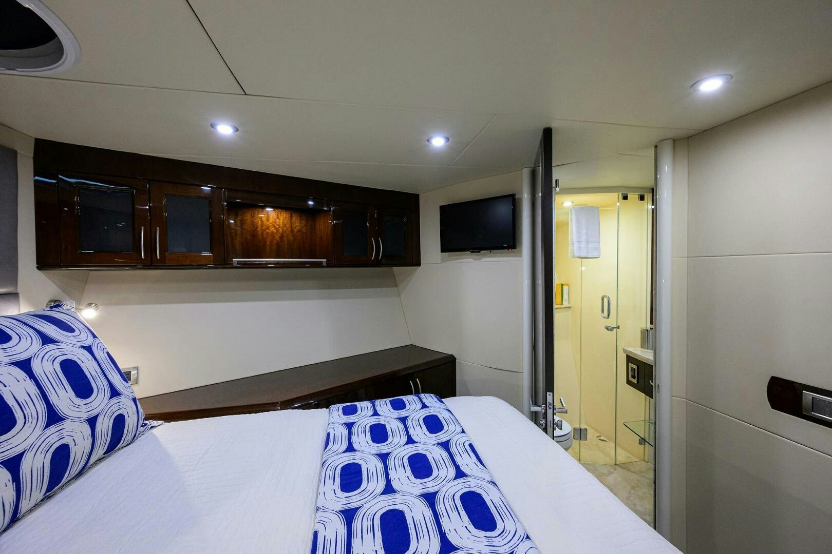 a room with a bed and a television aboard VIXEN Yacht for Sale