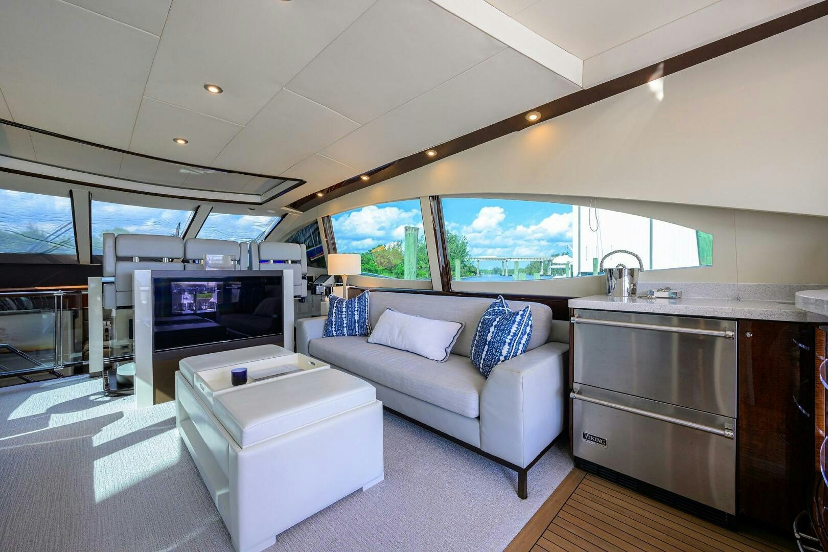 a living room with a couch and a tv aboard VIXEN Yacht for Sale