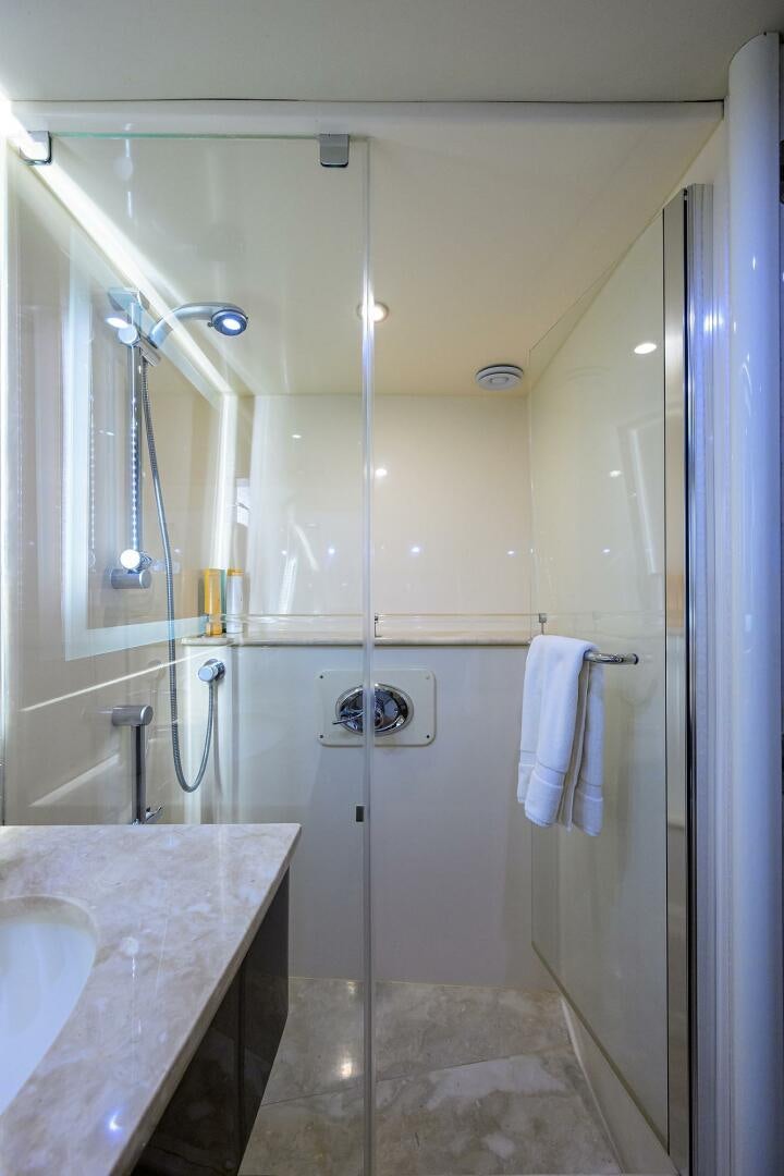 a bathroom with a shower and sink aboard VIXEN Yacht for Sale