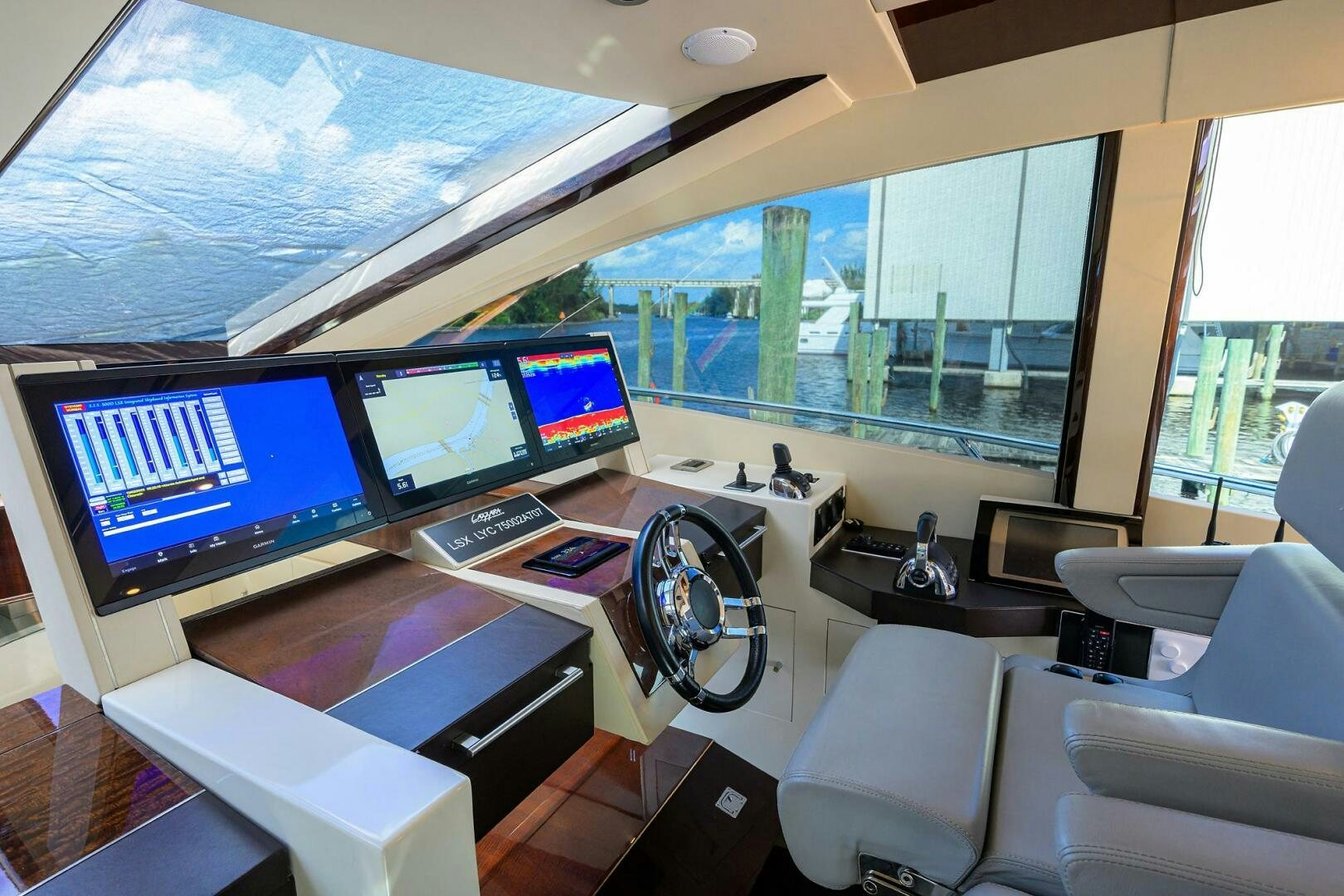 a room with many monitors and a window aboard VIXEN Yacht for Sale