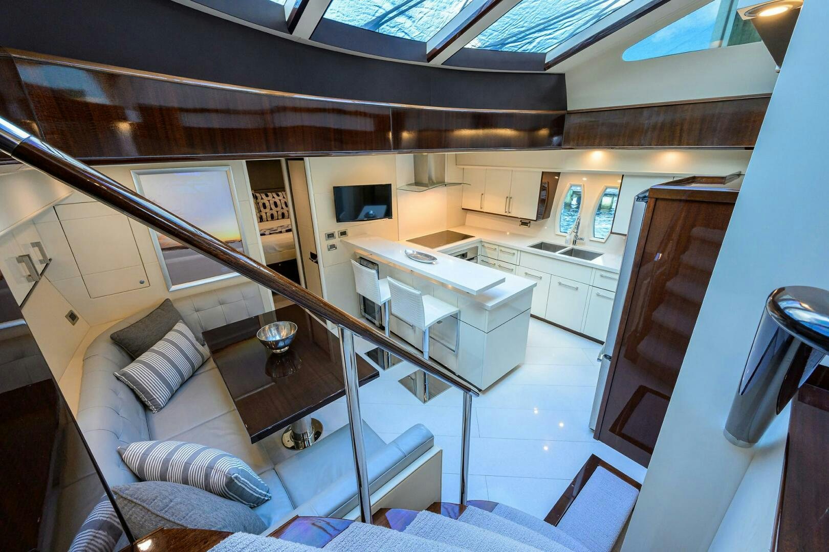 a room with a couch and a television aboard VIXEN Yacht for Sale