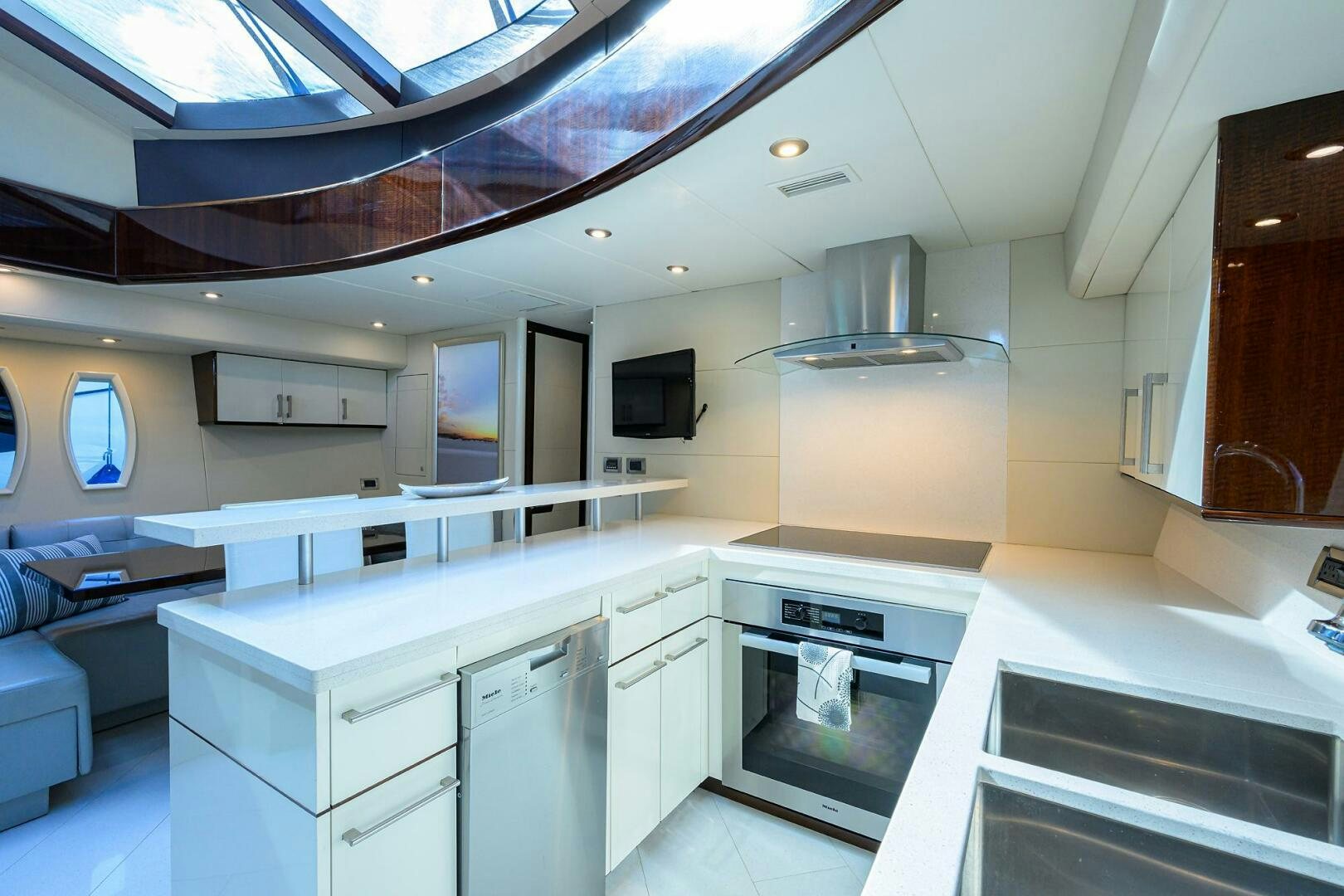 a kitchen with white cabinets aboard VIXEN Yacht for Sale