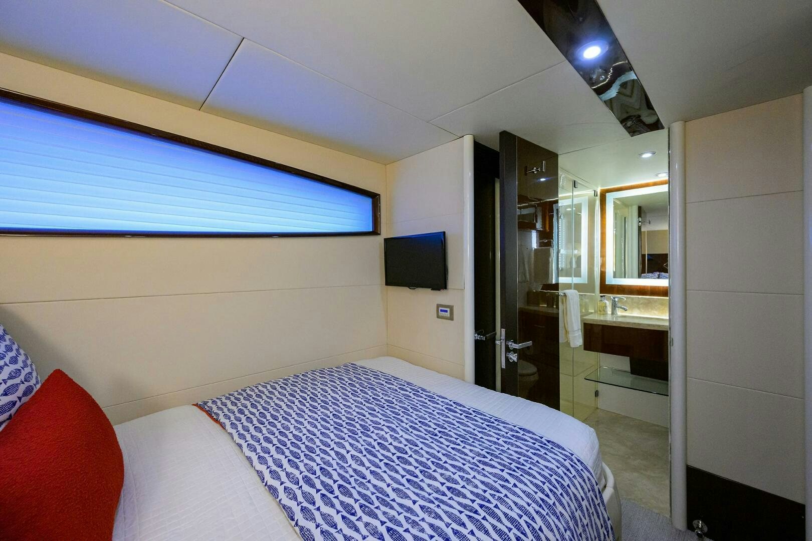 a room with a bed and a television aboard VIXEN Yacht for Sale