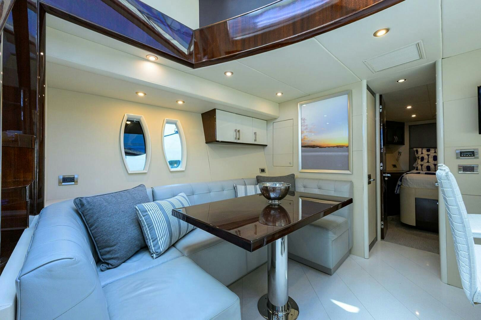 a living room with a table and couch aboard VIXEN Yacht for Sale