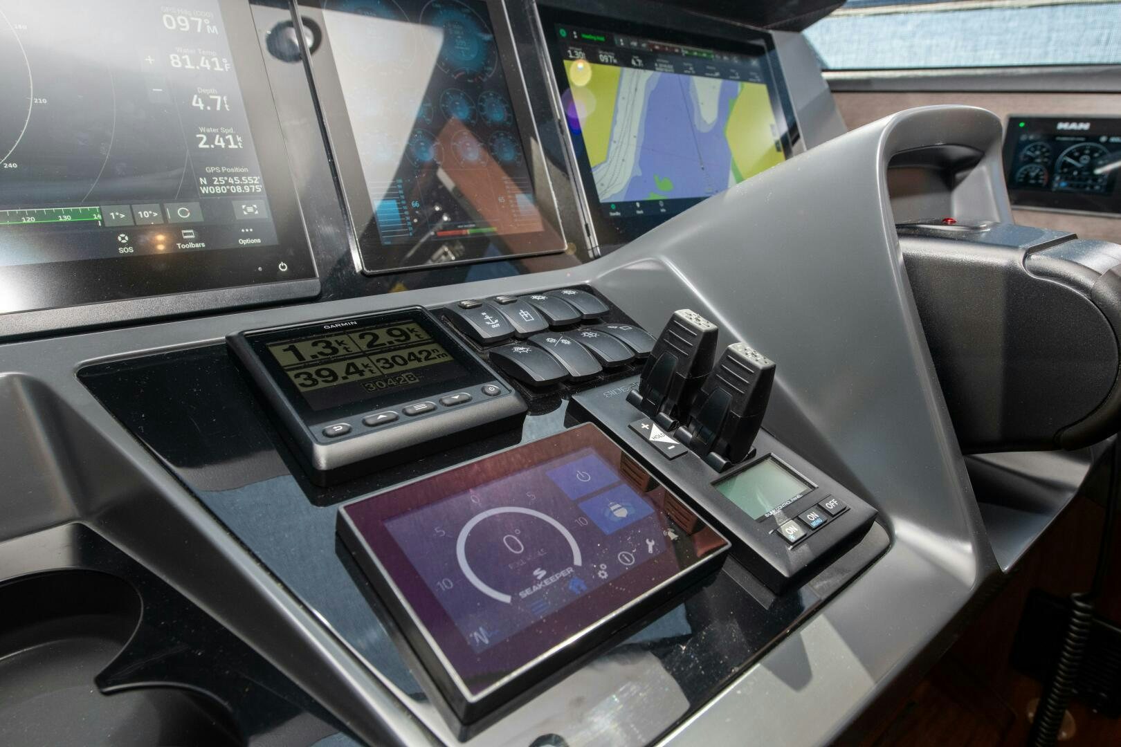 a desk with a computer and a phone on it aboard LADY D Yacht for Sale