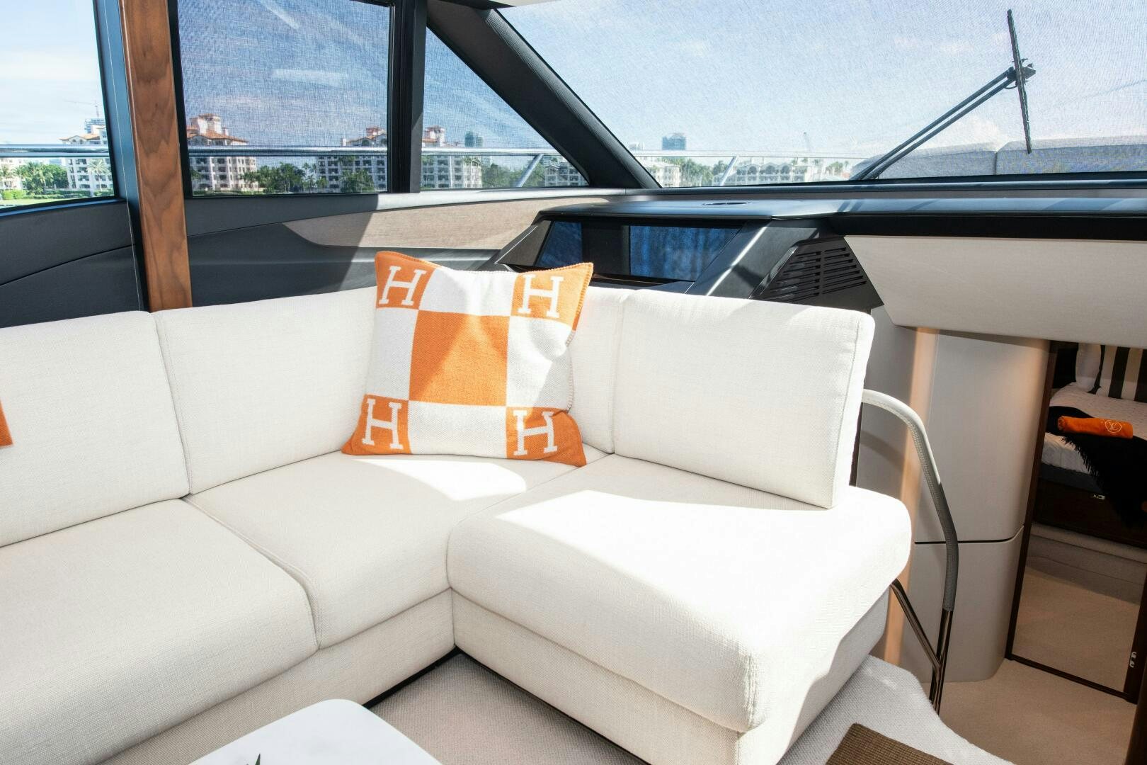 a white couch with orange pillows aboard LADY D Yacht for Sale