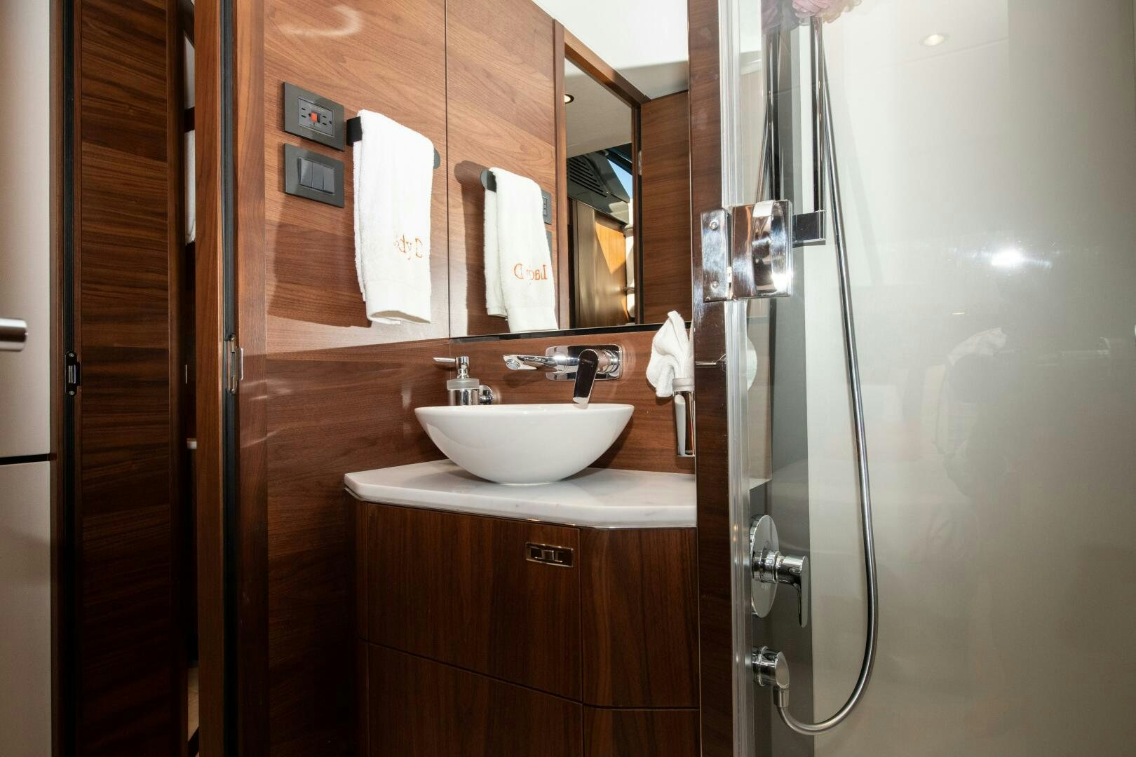 a bathroom with a sink and a mirror aboard LADY D Yacht for Sale