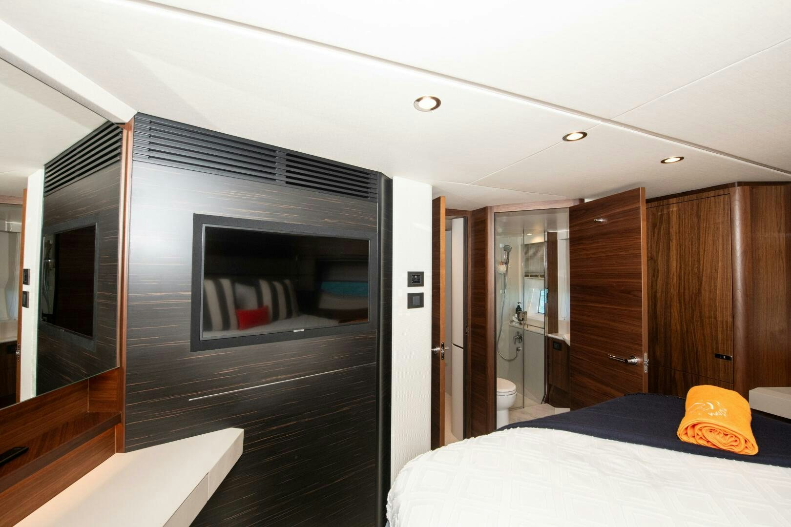a bedroom with a bed and a television aboard LADY D Yacht for Sale