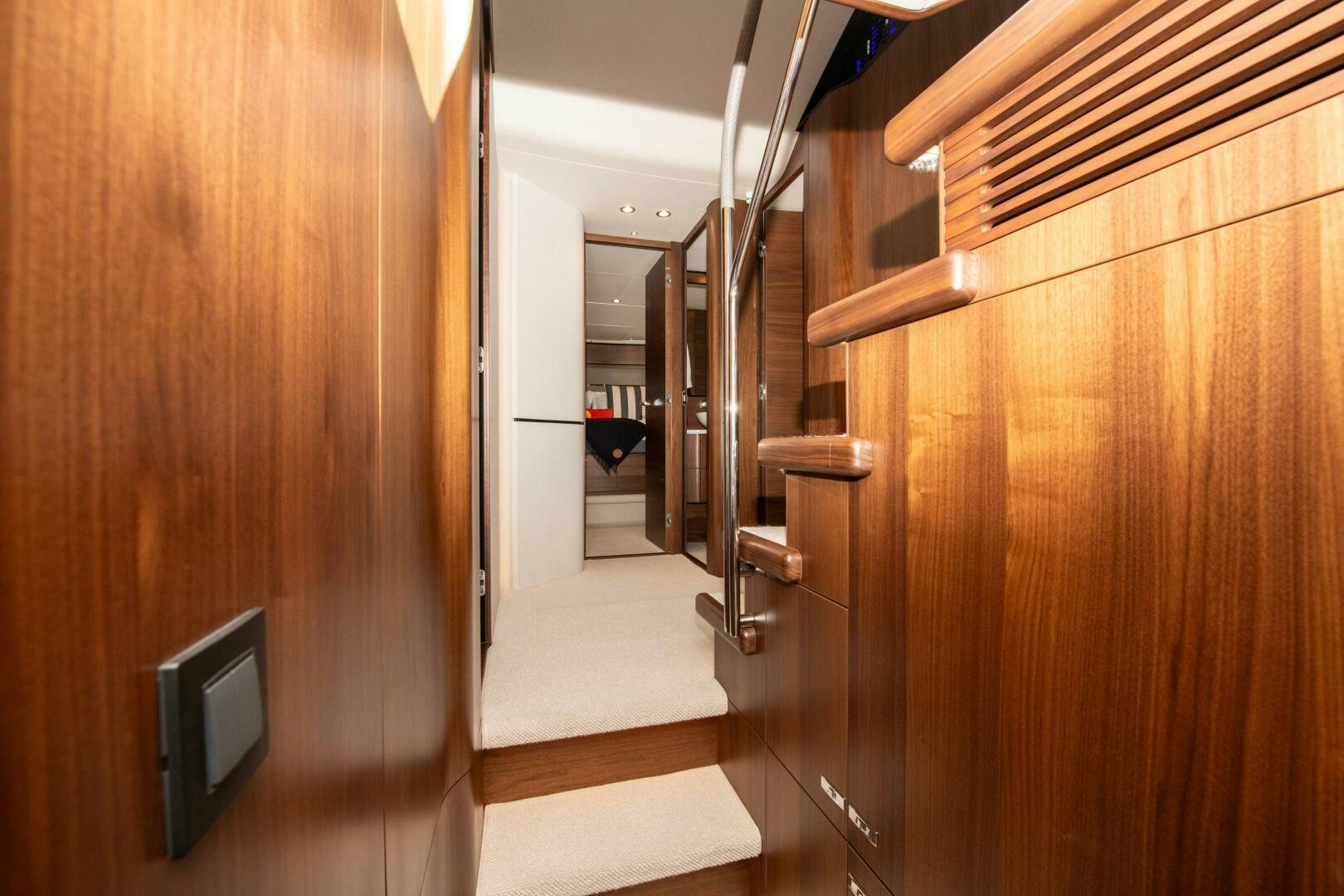 a hallway with wooden cabinets aboard LADY D Yacht for Sale