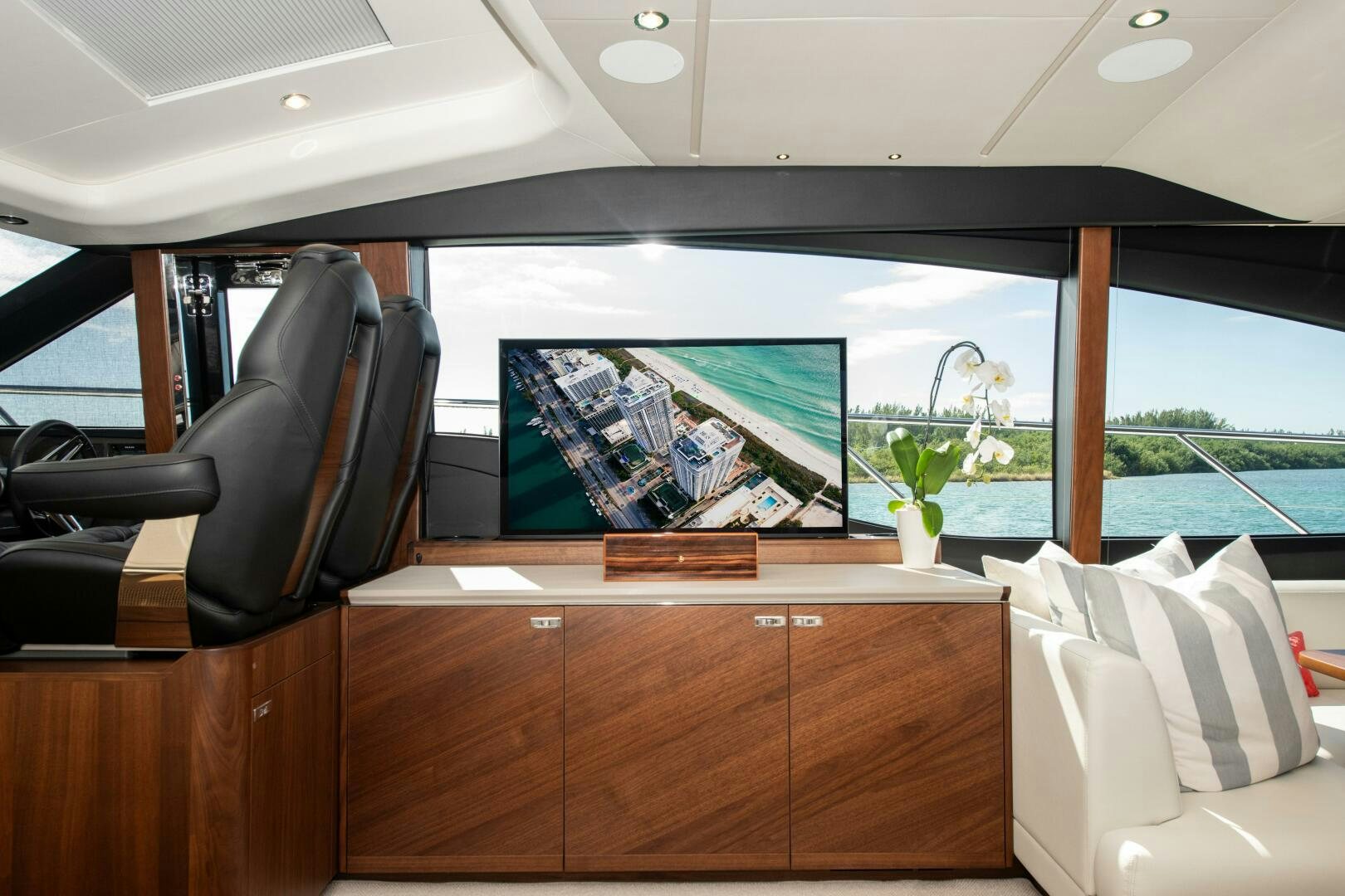 a room with a window and a plant in it aboard LADY D Yacht for Sale