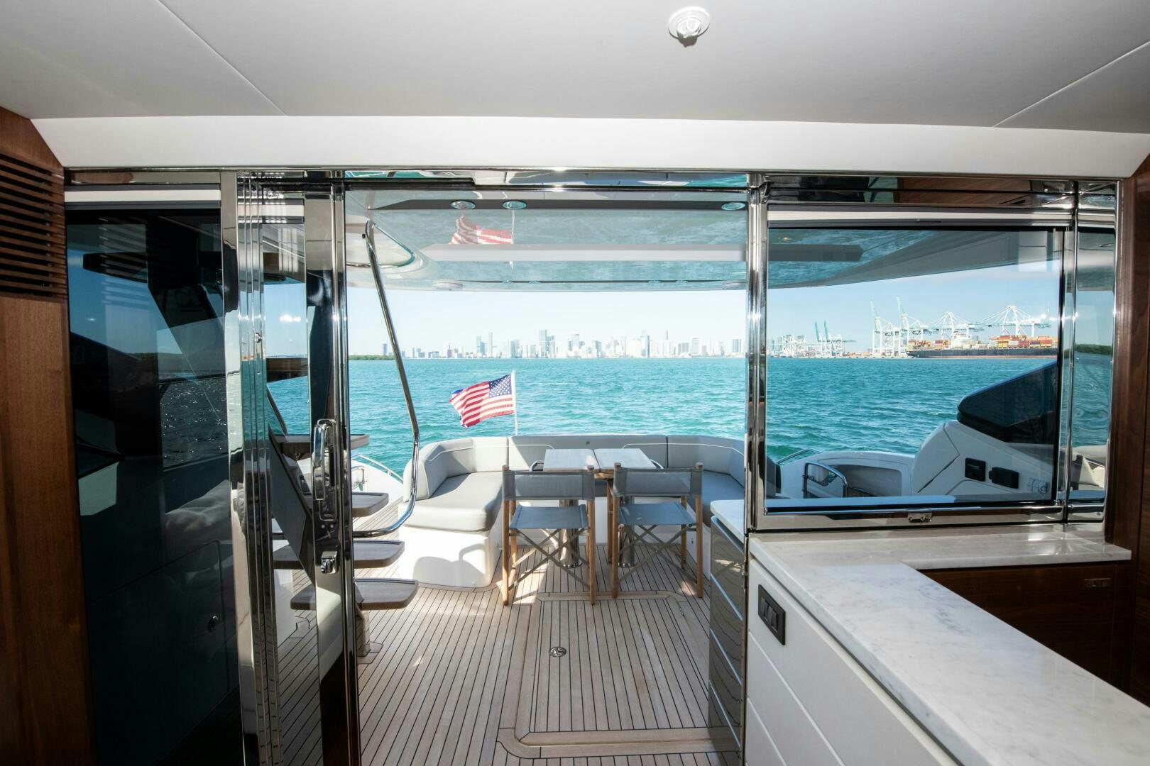 a room with a view of the ocean and a deck aboard LADY D Yacht for Sale