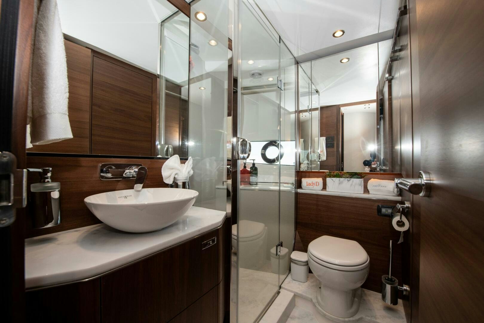 a bathroom with a glass shower aboard LADY D Yacht for Sale