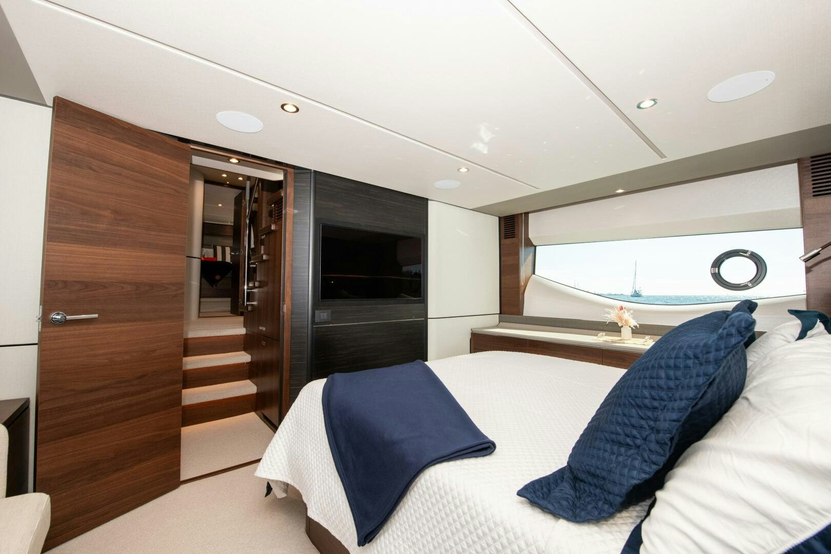 a room with a bed and a television aboard LADY D Yacht for Sale
